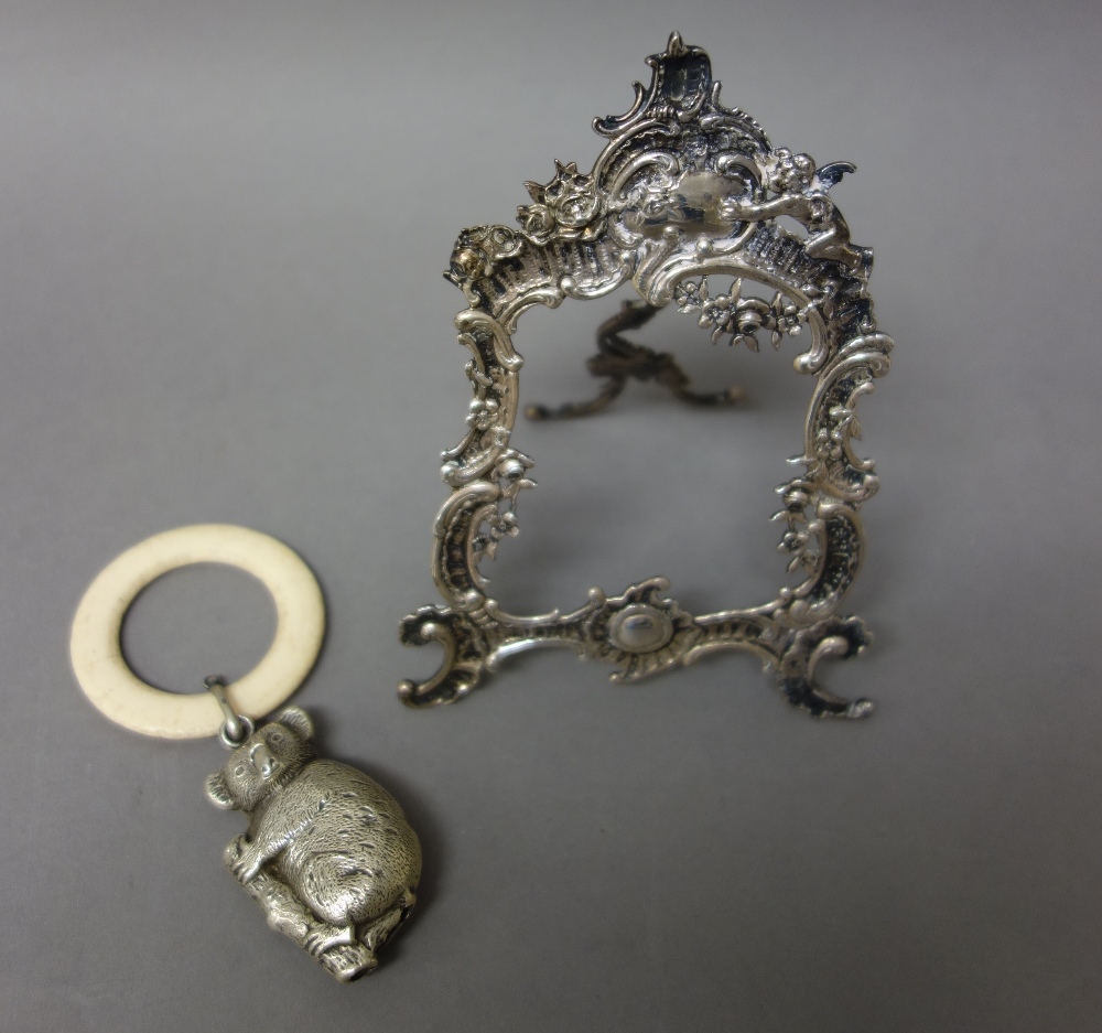 A silver photograph frame of cartouche shaped form, in the Rococo style,