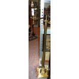 A 20th century brass adjustable standard lamp of Corinthian column form. 114cm wide.