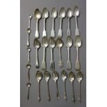 Silver, comprising; eight Scottish fiddle pattern teaspoons, five figure terminal teaspoons,
