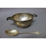 An Irish silver twin handled christening porringer of circular form,