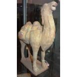 A Tang style pottery Bactrian camel, standing four square with head raised,