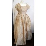 A gold evening dress with underskirt, an