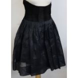 A black velvet skirt, by Martinique, a b