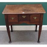 A George II oak lowboy, the shaped frieze with three drawers, on club supports,