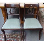 A set of twenty-two Regency style brass inlaid mahogany dining chairs,