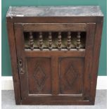 A 17th century oak hanging food cupboard,