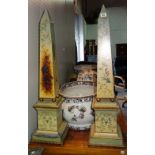 A pair of 20th century metal obelisks, with painted decoration, (2).