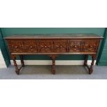 A Charles II and later oak dresser base, with three geometrically moulded frieze drawers,