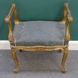 A Rococo Revival gilt piano stool, with shell moulded cabriole supports.