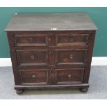 A Charles II and later oak chest of three long graduated moulded drawers,