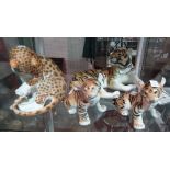 Four Russian ceramic animals; three tigers and a leopard, (4).