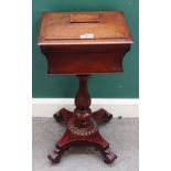 A late Regency mahogany teapoy, on a reeded baluster column,