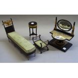 A suite of miniature gilt metal mounted Empire style furniture, to include; a day bed, 27cm wide,