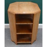 Probably Heals, a limed oak octagonal freestanding three tier bookcase, 59cm wide x 77cm high.