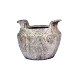 An Eastern dug out carved hardwood large carrying bowl, with a pair of splayed handles,