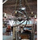 A silver painted wrought iron eight branch chandelier, late 20th century, of armillary sphere form,