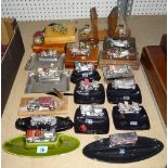 A quantity of 20th century desk stands and ashtrays of automobile interest, (qty).