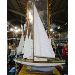 A 20th century scratch built model of a pond yacht, 73cm wide.