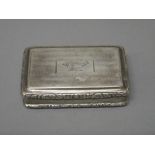 A George IV silver rectangular hinge lidded snuff box, gilt within and presentation inscribed,