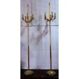 A pair of Victorian style three branch triform standard lamps, modern, on lions paw feet,