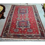 A Soumac carpet, Caucasian, the madder field with two medallions, minor motifs,