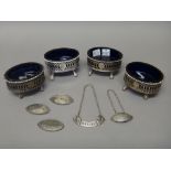 Four George III silver oval salts, each with pierced decoration,