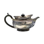 A George III Irish silver teapot, of compressed circular form, having decorated rims and bands,