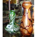 A 20th century Loetz style green glass vase and another similar orange glass vase, (2).