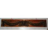 A gilt faux plaster style swag and mask embellishment/surmount, 180cm wide.