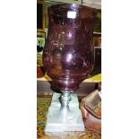 A pair of 20th century silvered metal hurricane lamps with amethyst glass shades, one broken, (a.