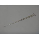A George III silver skewer, with a ring shaped handle, London probably 1768, length 28cm,