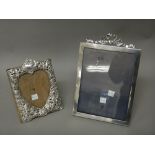 A silver mounted rectangular photograph frame, having a tied bow surmount,