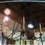 A modern wrought iron six branch chandelier of open frame form, 95cm high.