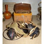 A Bakelite cased Ohms meter and another cased, together with a quantity of vintage radio headphones,