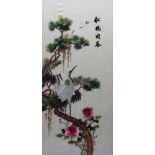 A Japanese silk work picture of cranes in a tree, 74 x 32.5cm.