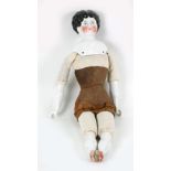 A French doll, 19th century, with ceramic head and shoulders, lower arms and lower legs,