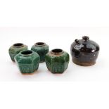 Four Chinese provincial moulded and green glazed small hexagonal jars,