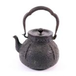 A Japanese cast iron tetsubin (kettle) and bronze cover, 19th century,