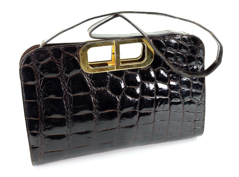 A Christian Dior black crocodile skin handbag, with gilt metal hardware, internal zip pocket,