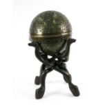 A spherical brass hand warmer, late 19th/early 20th century, hinged and divided,