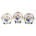 Three Dutch Delft polychrome plates, late 18th century,