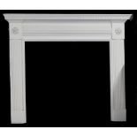 A white painted fire surround in George III style, with verde antico marble inserts, 135cm wide.
