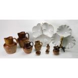 A collection of six Doulton and other stoneware harvest jugs and a similar salt cellar and pepper,