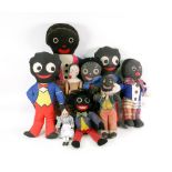 A vintage Deans Rag Knockabout toy golliwogg, 26cm, two wooden Dutch dolls,