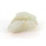 A Chinese jade group, carved as three eggplants, with leafy stalks, the stone of pale celadon tone,