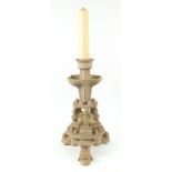 Mike Cuzner - a contemporary studio pottery candlestick, supported on three fleur de lys,