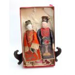 A pair of Chinese jointed dolls, of a man and a woman,