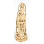 A Chinese carved ivory figure of a guanyin, second half 19th century, standing on a lotus flower,