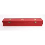 A narrow rectangular red faux leather covered College of Arms box,