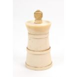 An Art Deco turned ivory capstan pepper mill, with fluted capital, 9.5cm high.